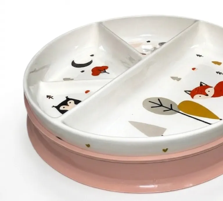 A divided porcelain toddler plate with a pink silicone base